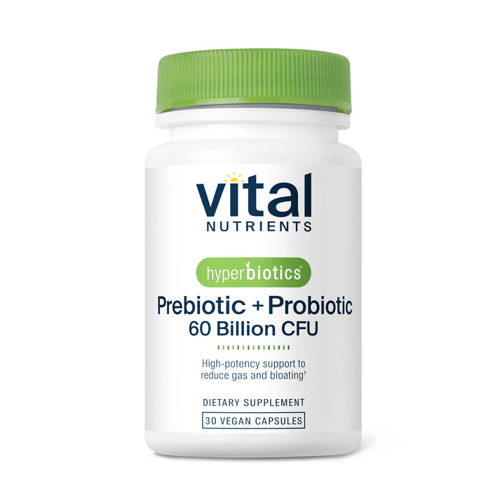 A white bottle of "Vital Nutrients" prebiotic and probiotic capsules, featuring a green cap and labeled with dosage information.
