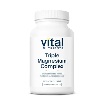 A white bottle labeled "Vital Nutrients Triple Magnesium Complex" with 90 vegan capsules, promoting healthy metabolism and stress response.